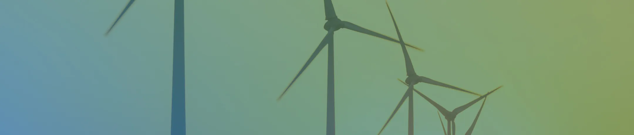Wind turbines in the distance with a green-to-blue gradient overlay, representing RELA’s commitment to renewable energy projects across regional landscapes